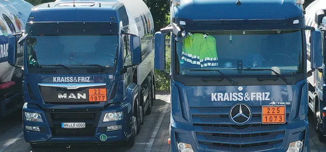 Row of KRAISS & FRIZ delivery trucks